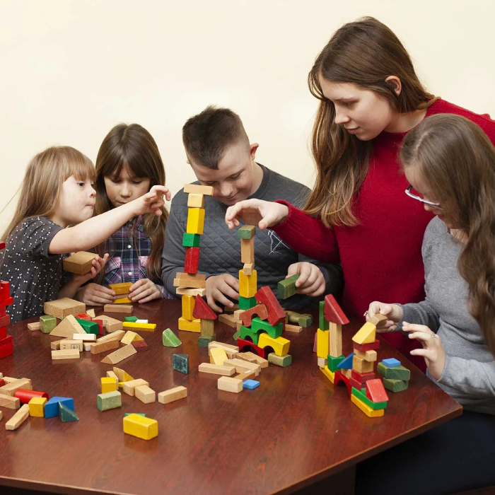 NDIS Community Participation Adelaide: Kids & adults building with blocks